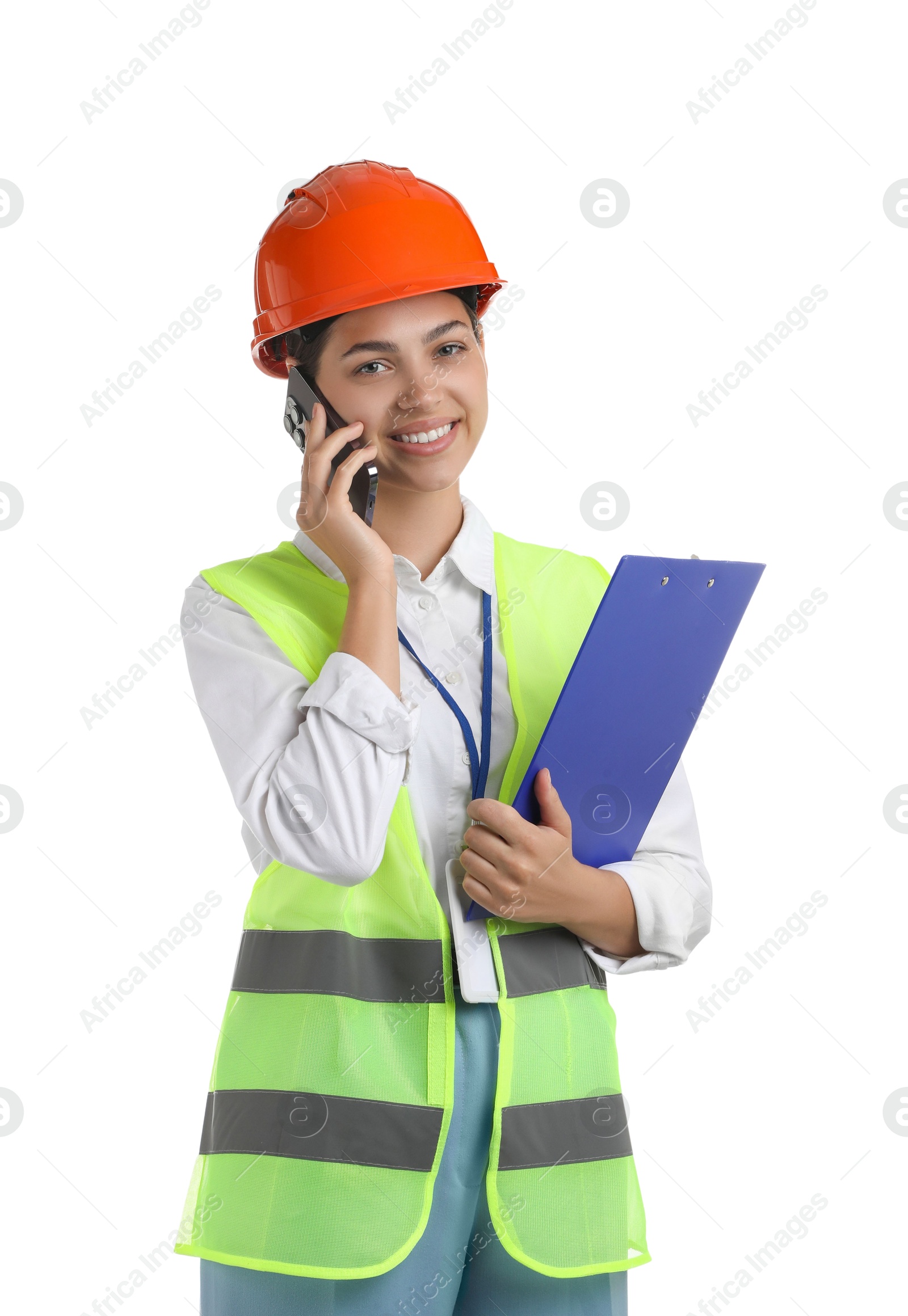 Photo of Engineer in hard hat with clipboard talking on smartphone against white background