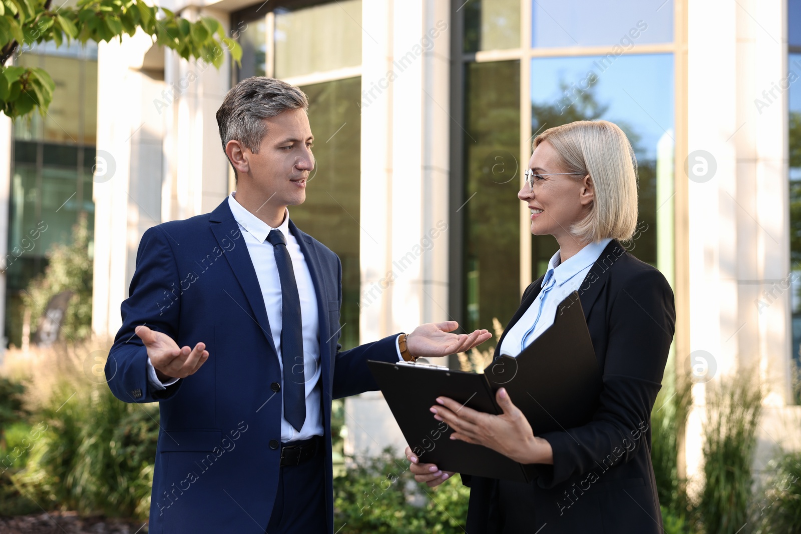 Photo of International relations. Diplomats talking during meeting outdoors