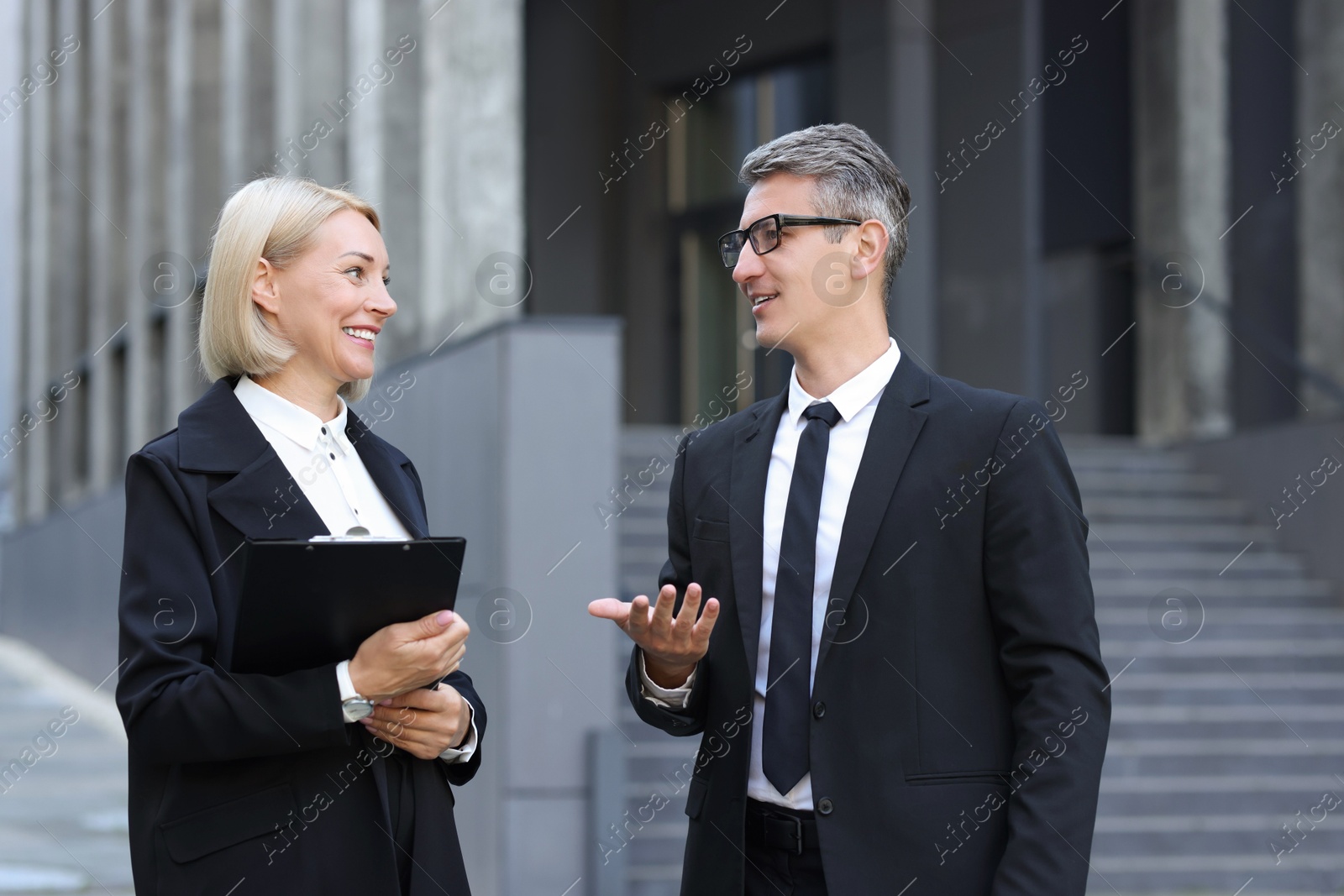 Photo of International relations. Diplomats talking during meeting outdoors