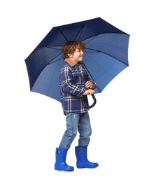 Little boy with blue umbrella on white background