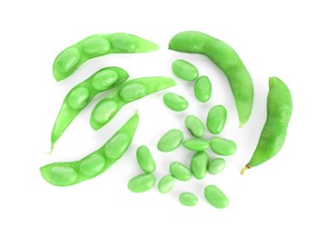 Photo of Raw green edamame soybeans and pods isolated on white, top view