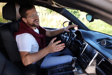 Man singing in car, view from inside