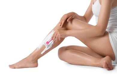 Photo of Woman shaving leg on white background, closeup