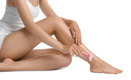 Photo of Woman shaving leg on white background, closeup