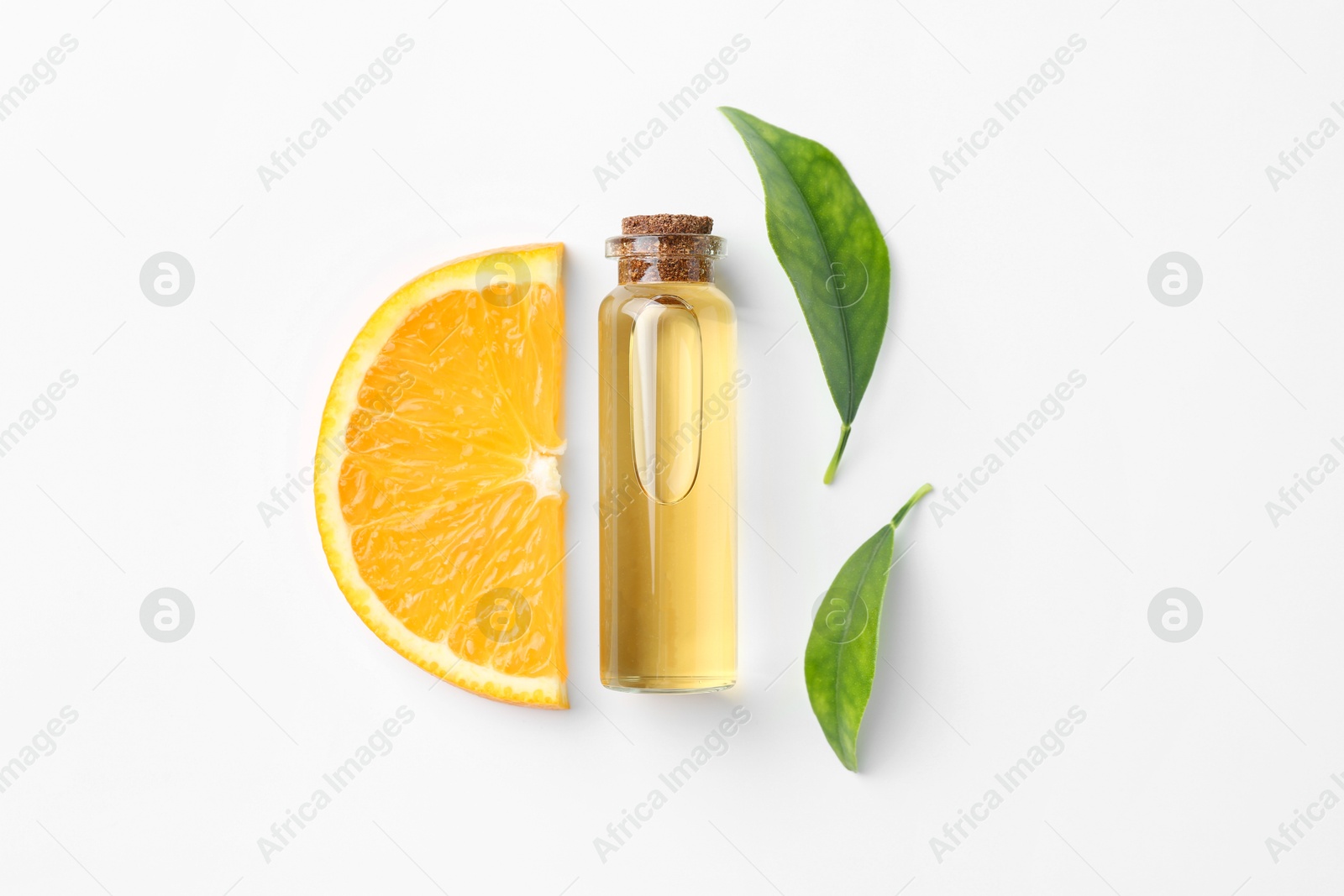 Photo of Bottle of essential oil, orange and green leaves on white background, flat lay