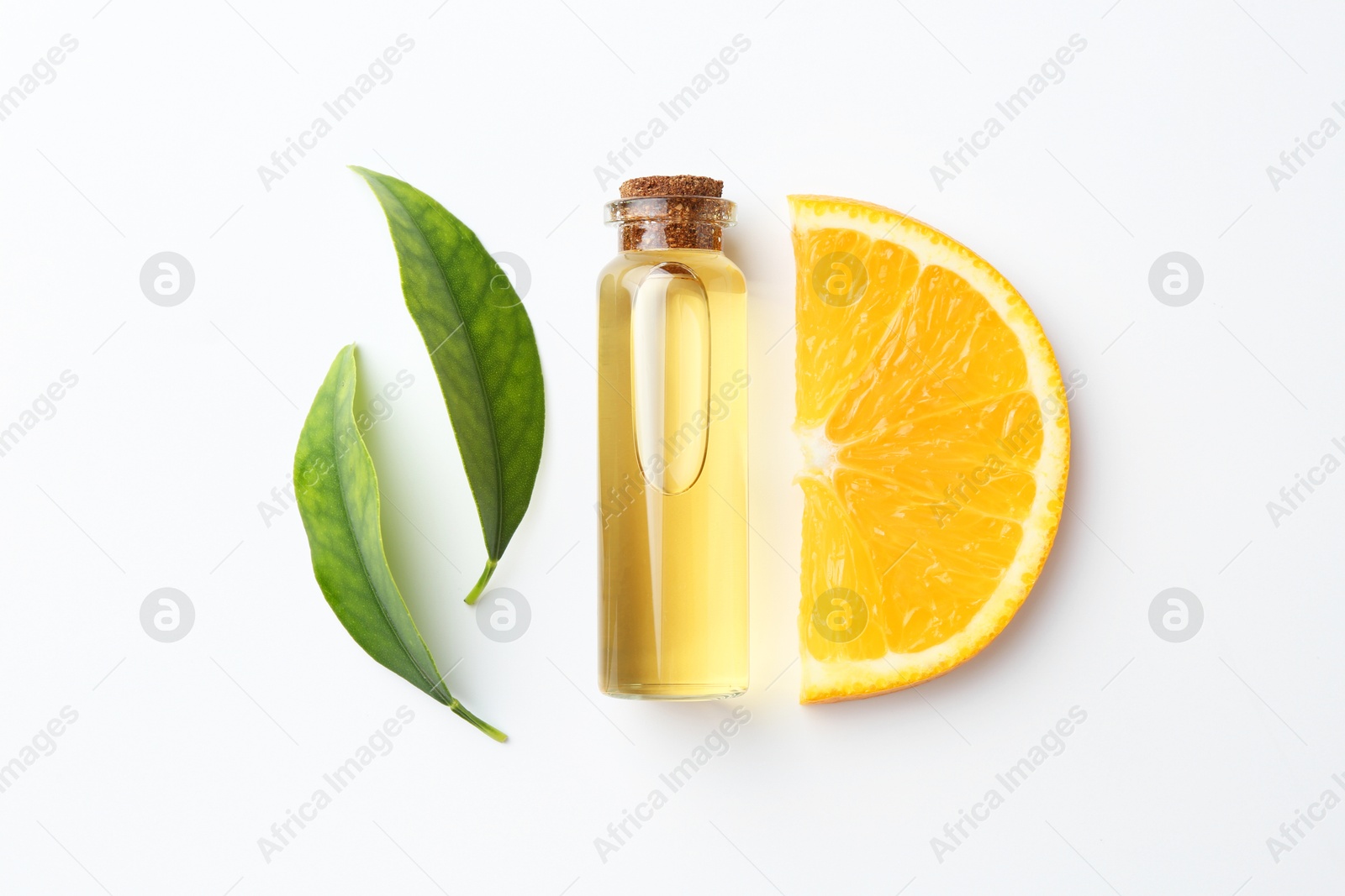 Photo of Bottle of essential oil, orange and green leaves on white background, flat lay