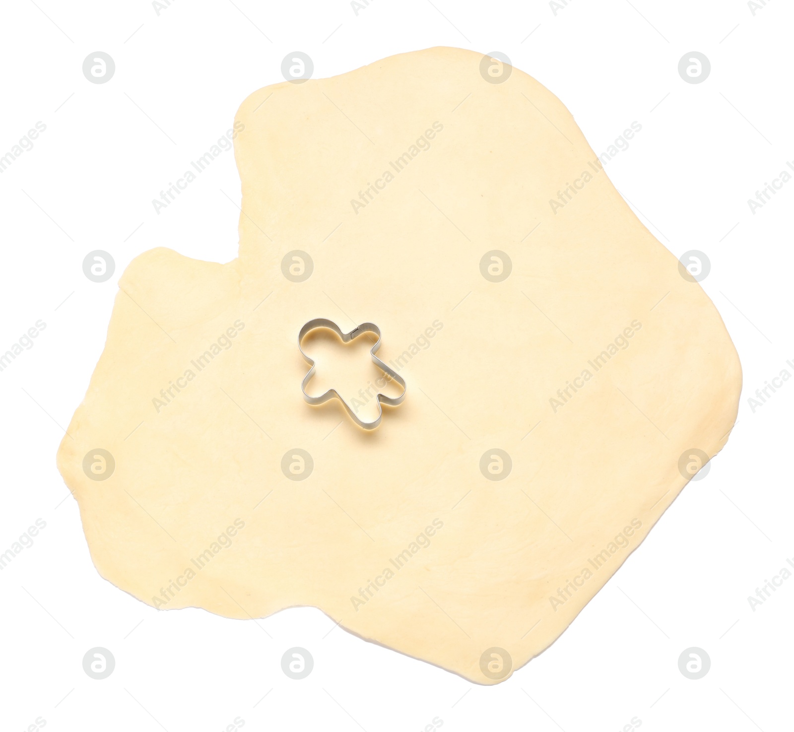 Photo of Raw dough and cookie cutter isolated on white, top view