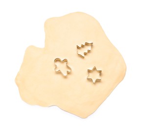 Photo of Raw dough and cookie cutters isolated on white, top view