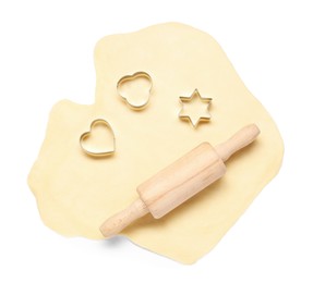 Raw dough, wooden rolling pin and cookie cutters isolated on white, top view