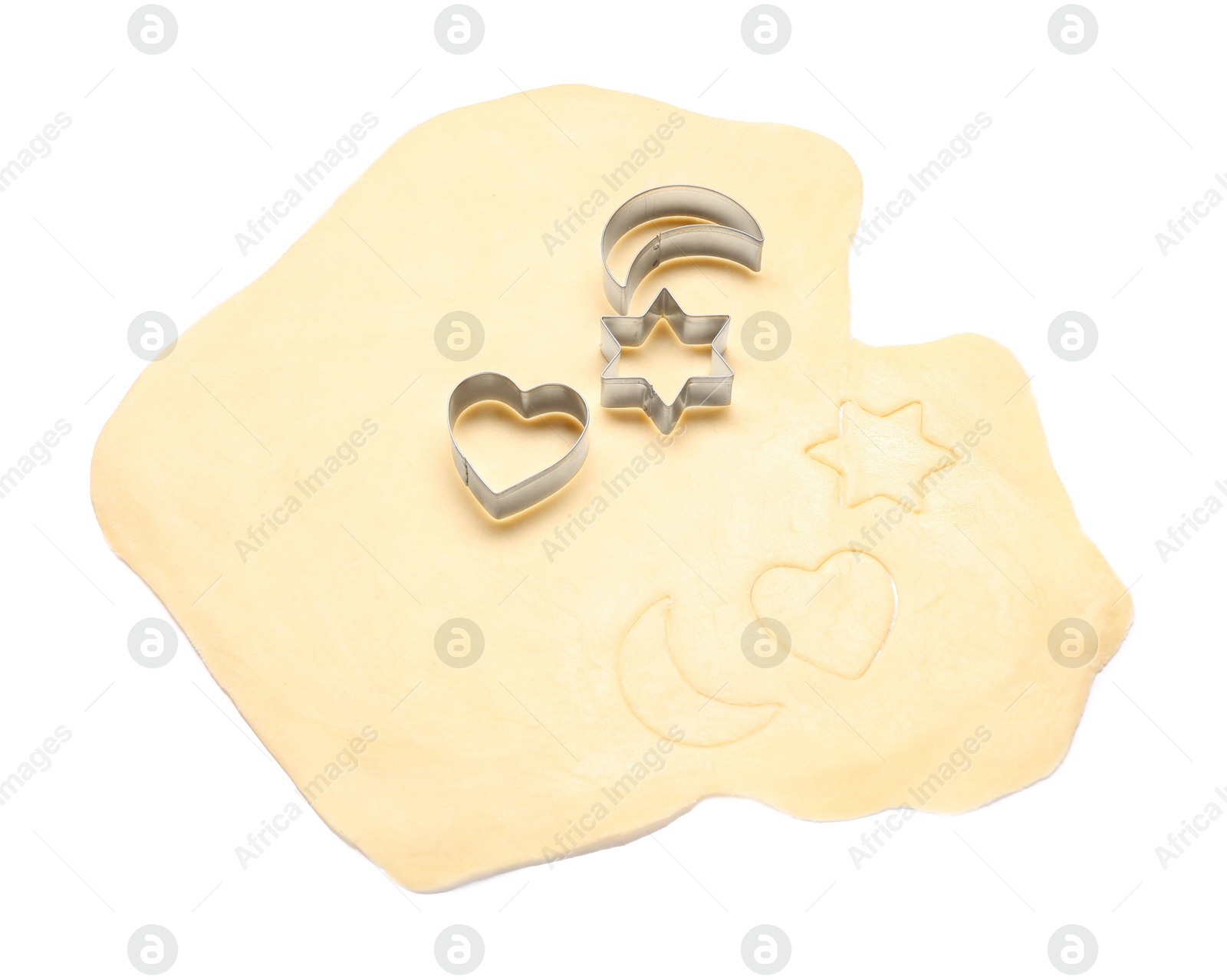 Photo of Raw dough and cookie cutters isolated on white, above view