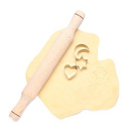 Photo of Raw dough, wooden rolling pin and cookie cutters isolated on white, top view