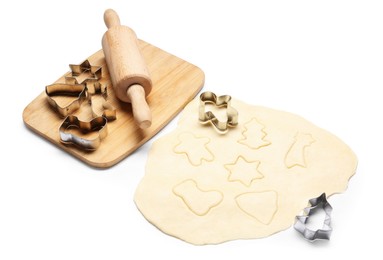 Photo of Raw dough, rolling pin, cookie cutters and board isolated on white