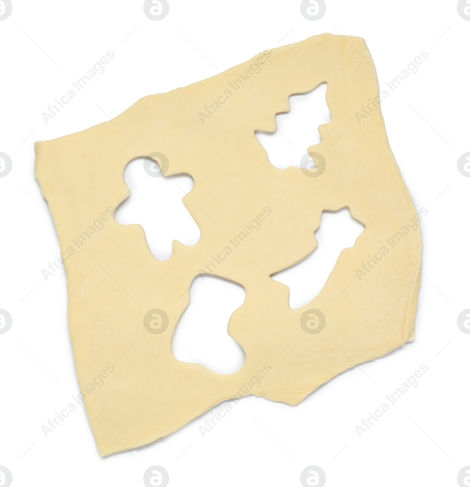 Photo of Raw dough with holes in different shapes isolated on white, top view