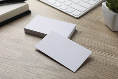 Photo of Group of blank business cards on wooden table. Mockup for design