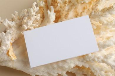 Photo of Blank business card on beige background, top view. Mockup for design