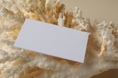 Blank business card on beige background. Mockup for design