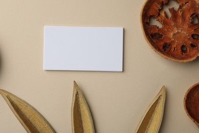 Photo of Blank business cards and dried products on beige background, flat lay. Mockup for design