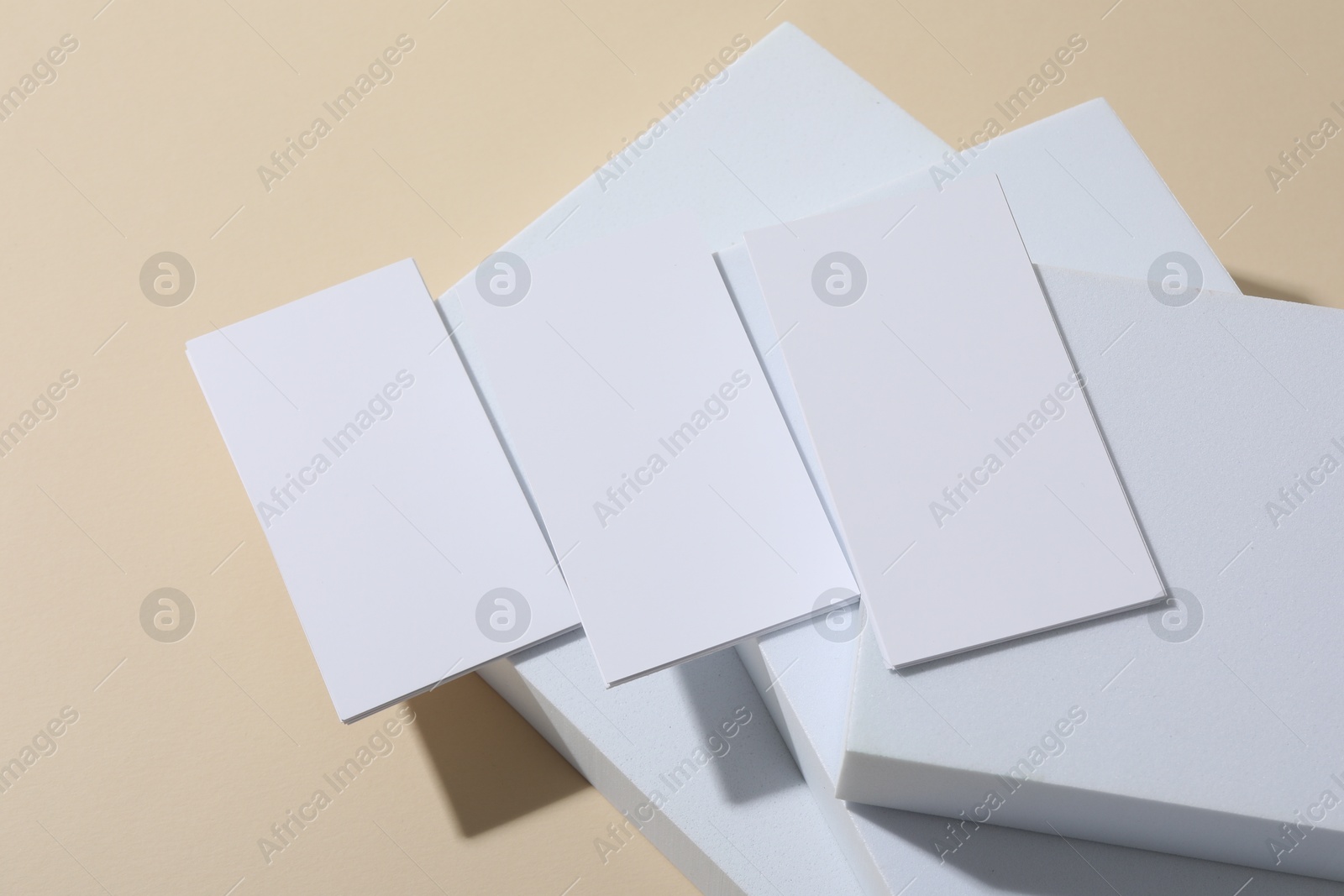 Photo of Blank business cards on beige background. Mockup for design