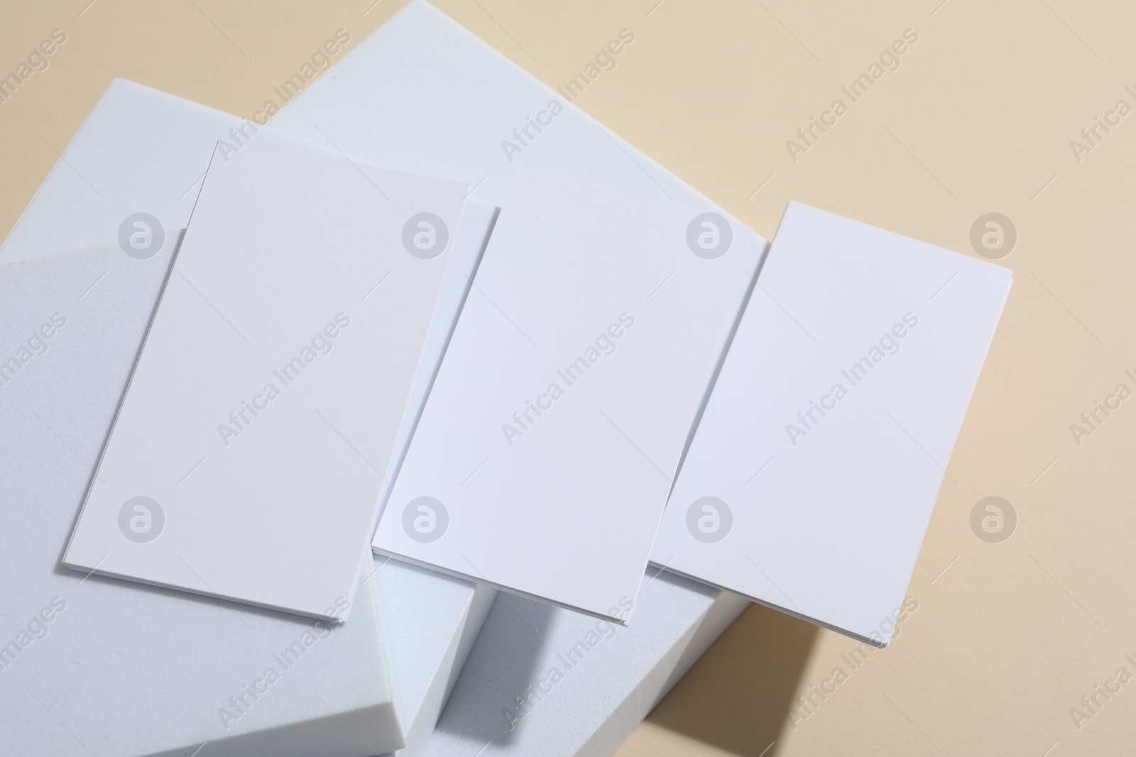 Photo of Blank business cards on beige background. Mockup for design