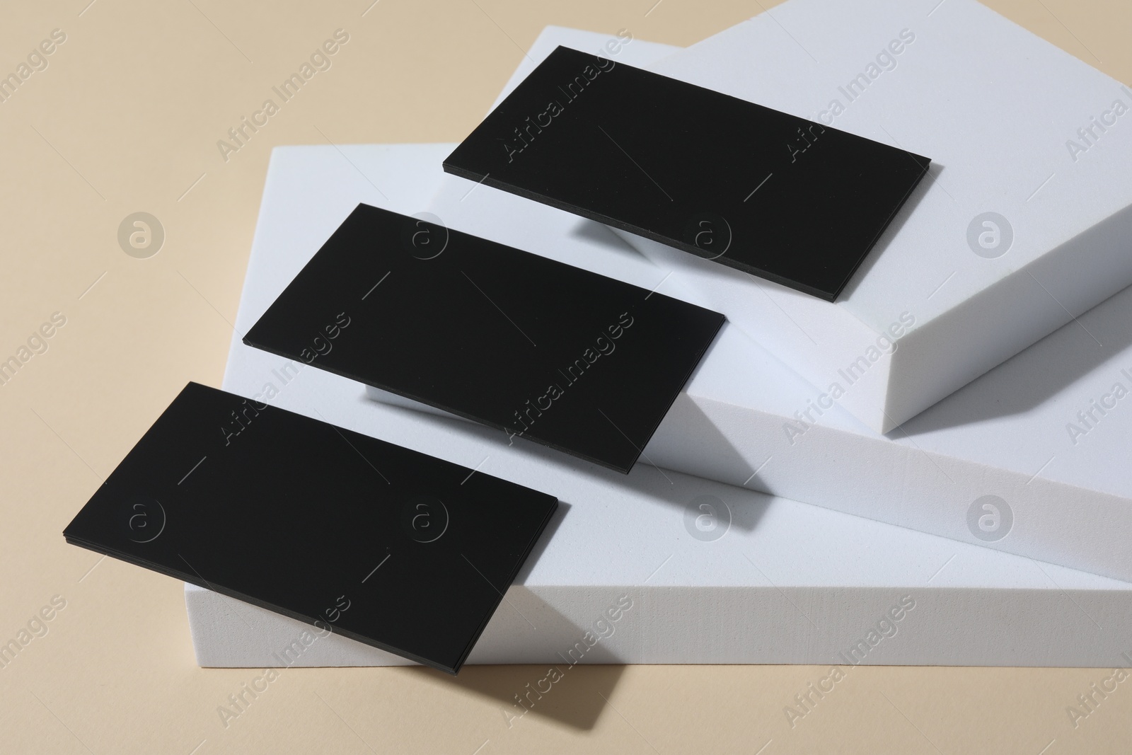 Photo of Blank business cards on beige background. Mockup for design