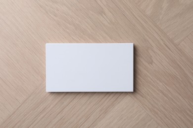 Blank business cards on wooden table, top view. Mockup for design