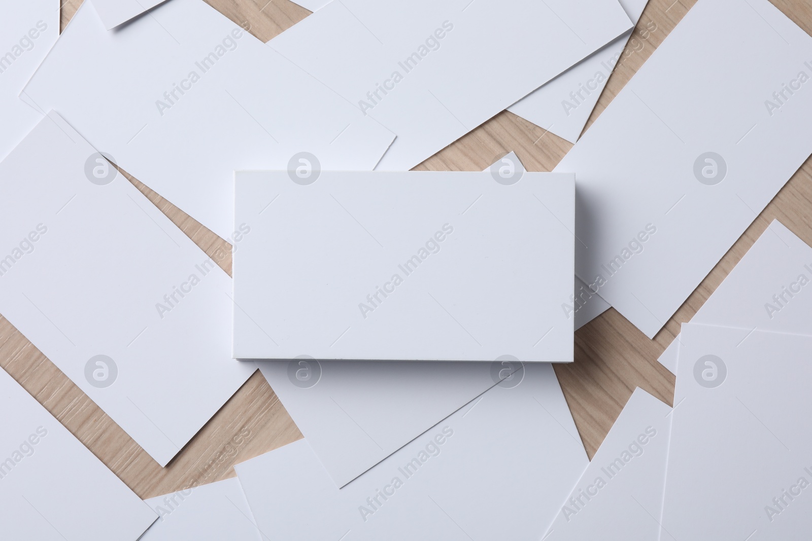 Photo of Blank business cards on wooden table, flat lay. Mockup for design