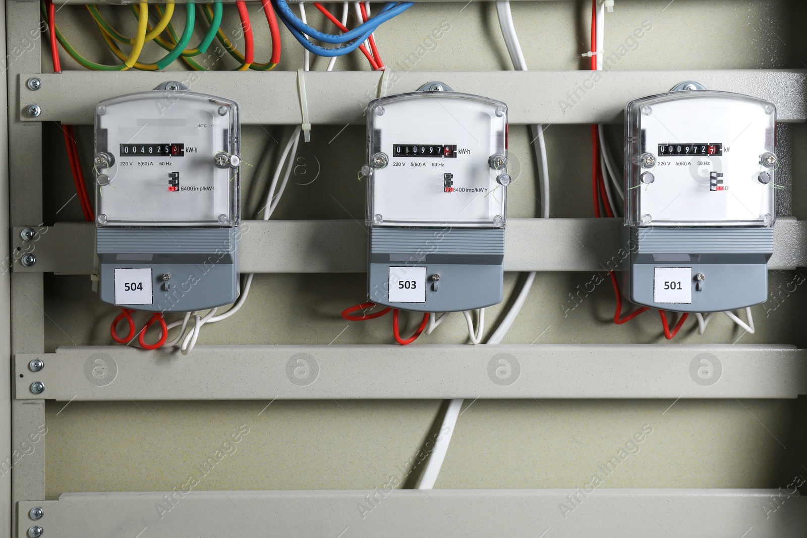 Photo of Electric meters and wires in fuse box. Energy measuring device