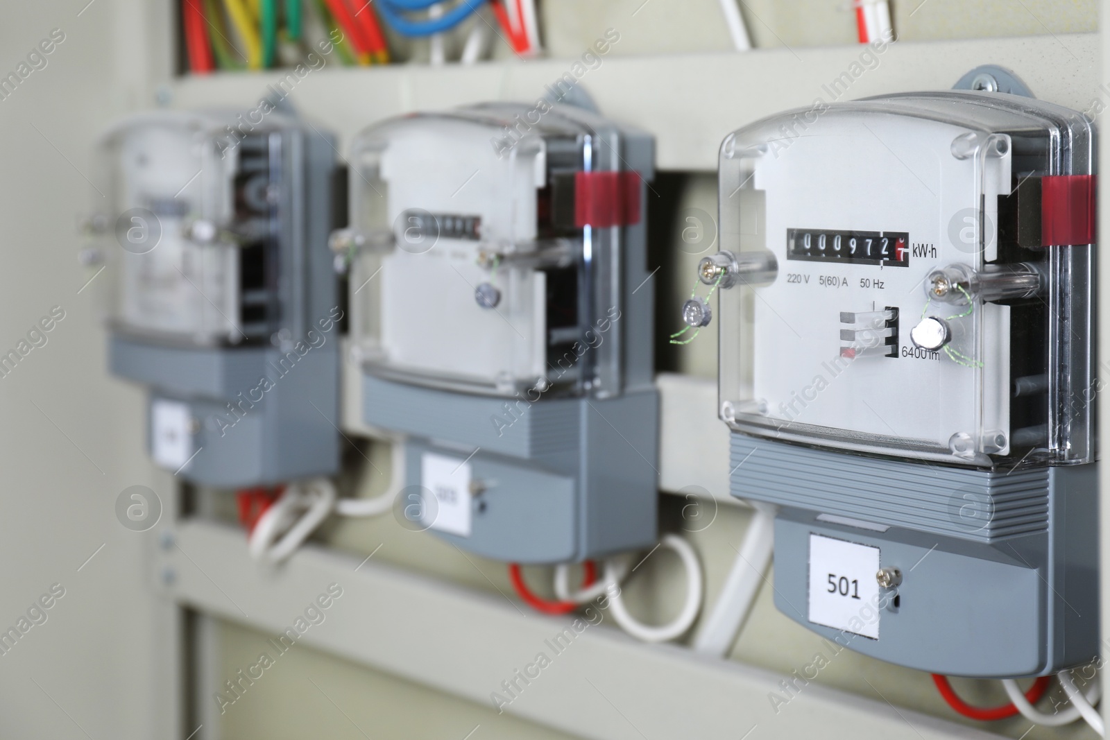 Photo of Electric meters and wires in fuse box. Energy measuring device