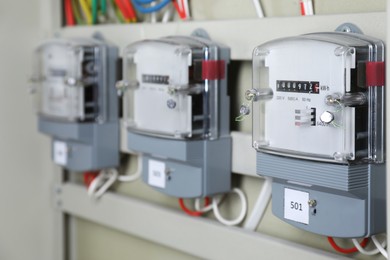 Photo of Electric meters and wires in fuse box. Energy measuring device