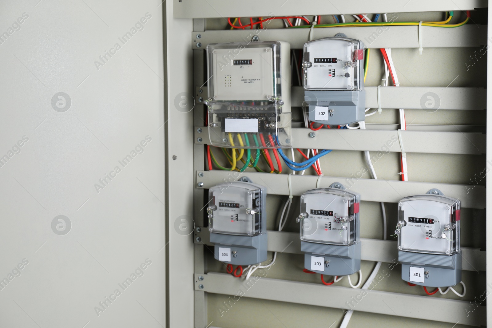 Photo of Electric meters and wires in fuse box, space for text. Energy measuring device