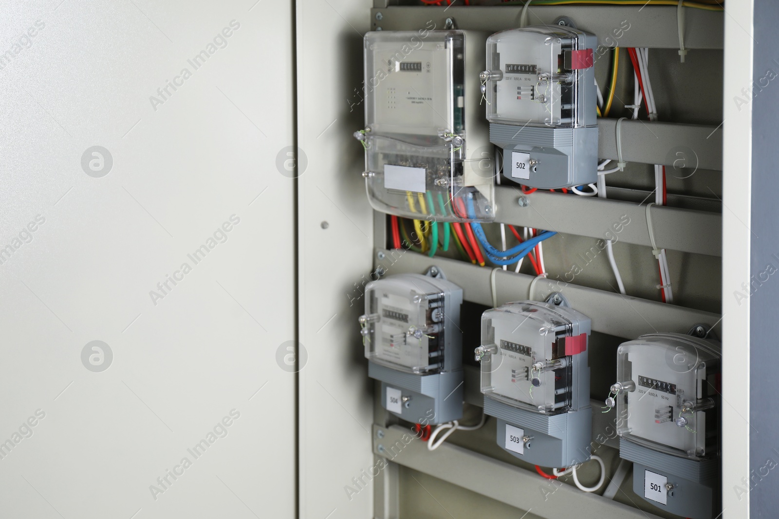 Photo of Electric meters and wires in fuse box, space for text. Energy measuring device