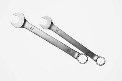 Photo of Two ratcheting wrenches on white background, top view. Auto mechanic tools