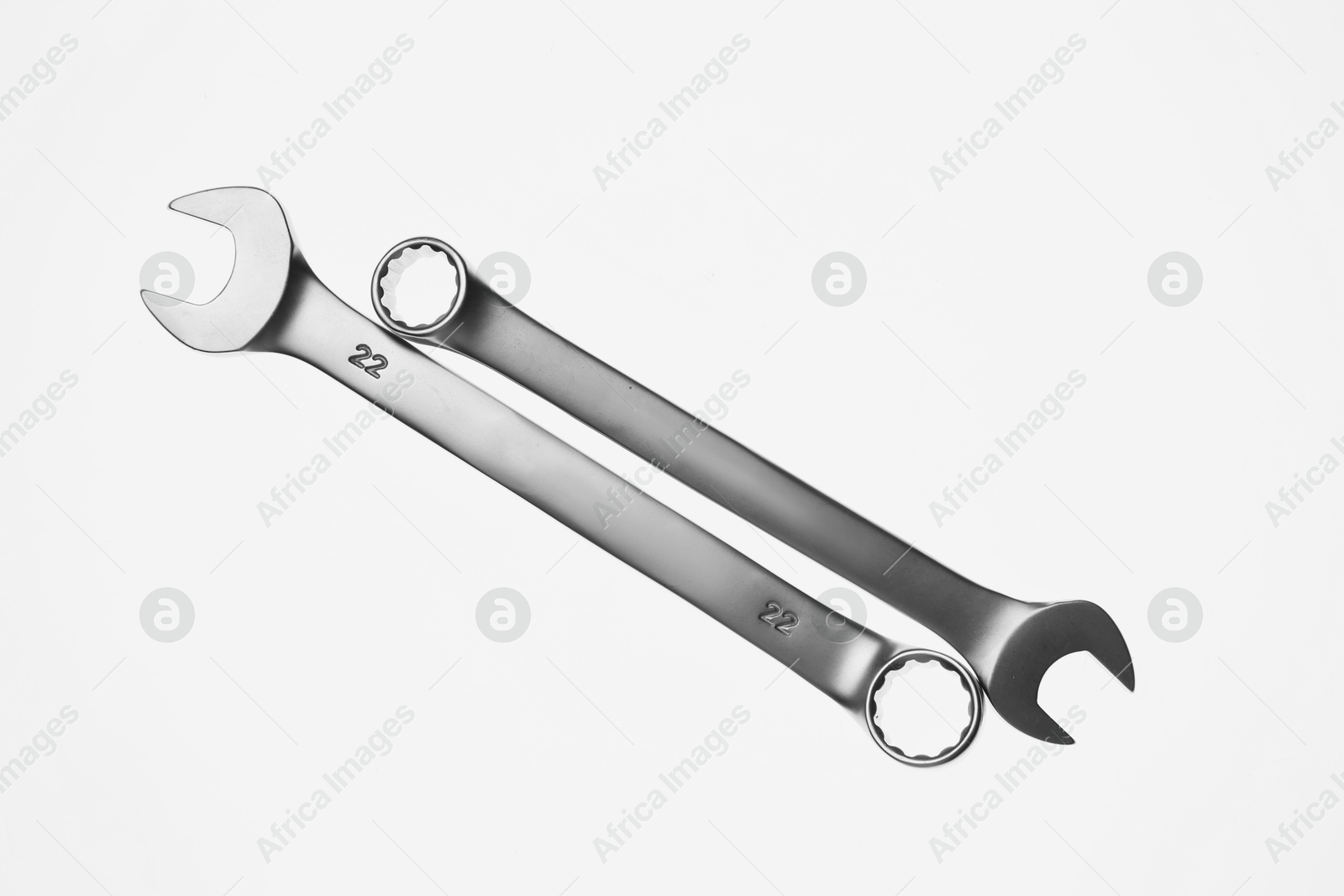 Photo of Two ratcheting wrenches on white background, top view. Auto mechanic tools