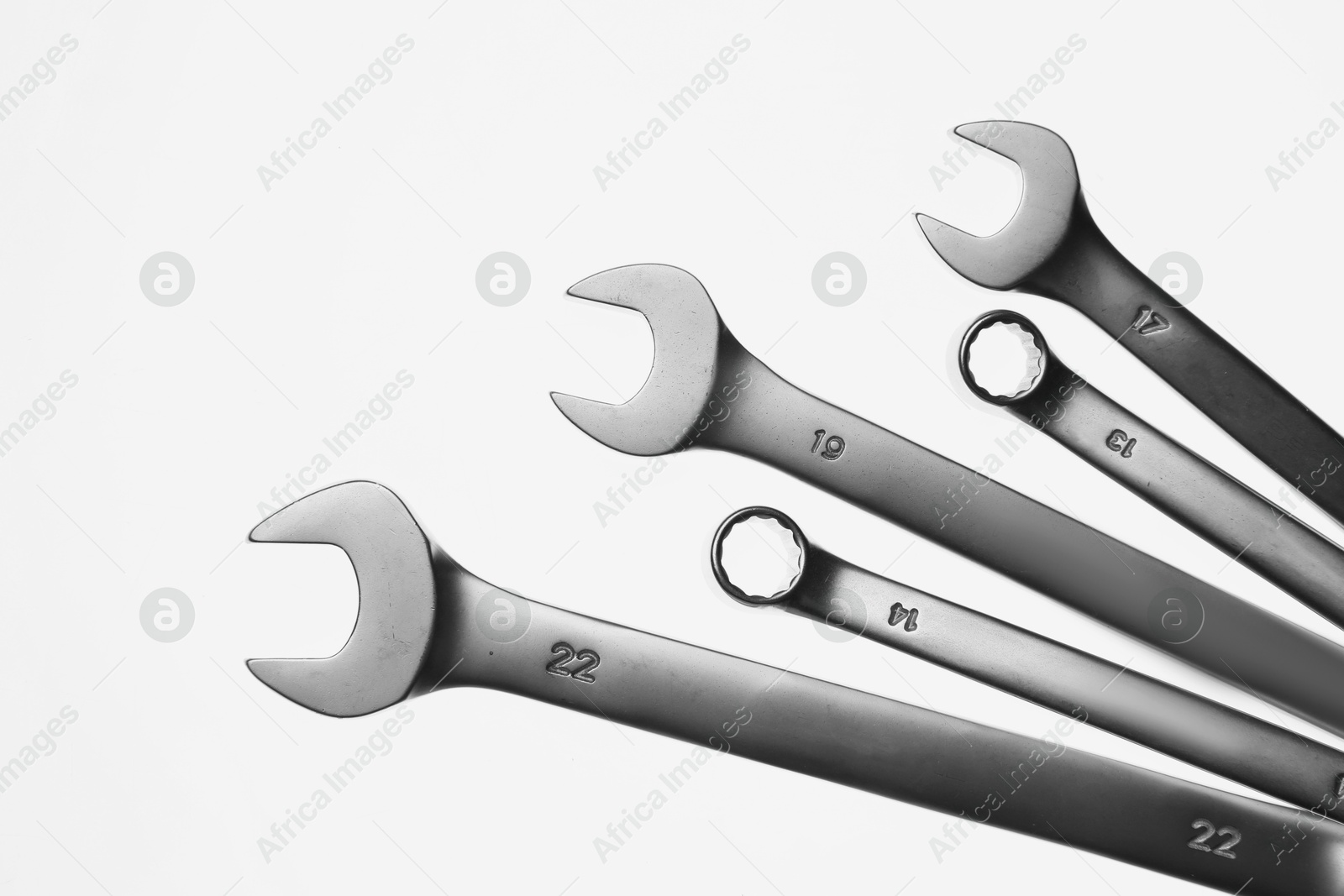 Photo of Set of ratcheting wrenches on white background. Auto mechanic tools