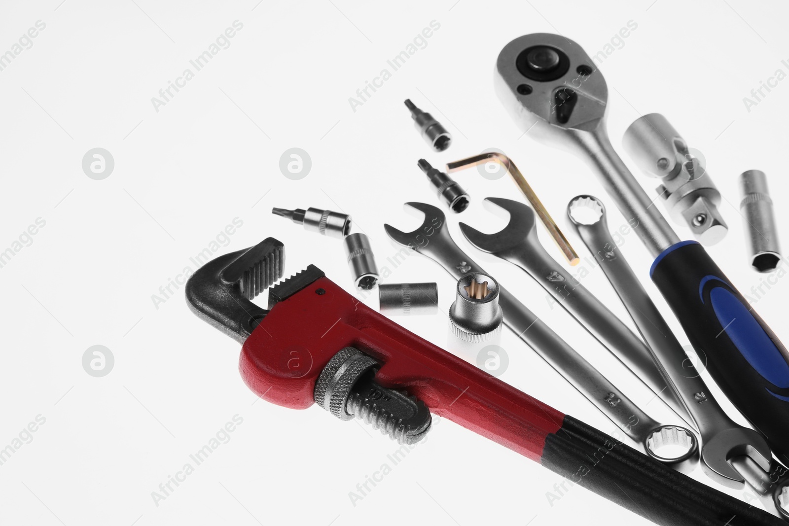 Photo of Set of auto mechanic's tools on white background