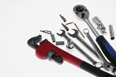 Photo of Set of auto mechanic's tools on white background