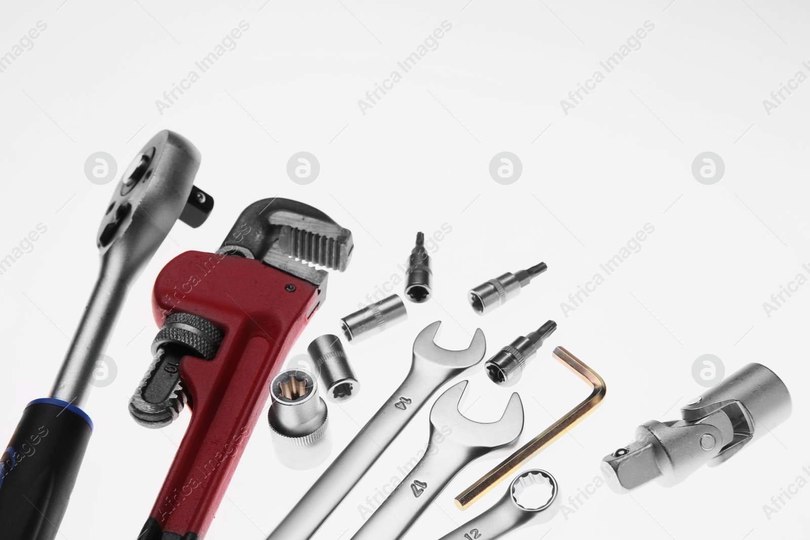 Photo of Set of auto mechanic's tools on white background