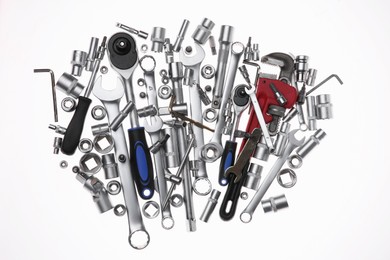 Set of auto mechanic's tools on white background, flat lay