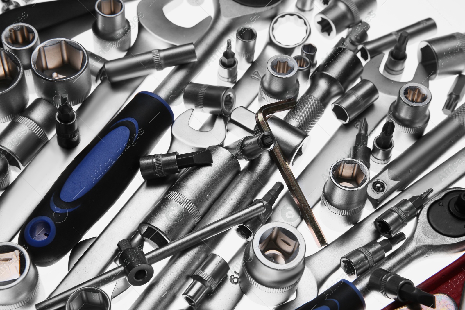 Photo of Set of auto mechanic's tools on white background