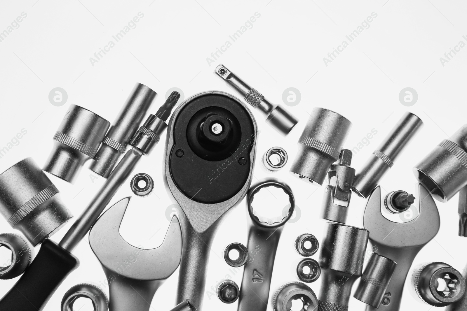 Photo of Set of auto mechanic's tools on white background, flat lay