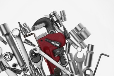 Photo of Set of auto mechanic's tools on white background, flat lay