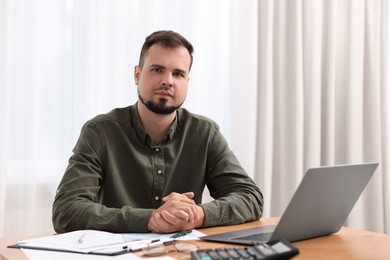 Photo of Portrait of business consultant at table in office