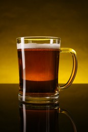 Photo of Glass of beer with froth on dark table, closeup