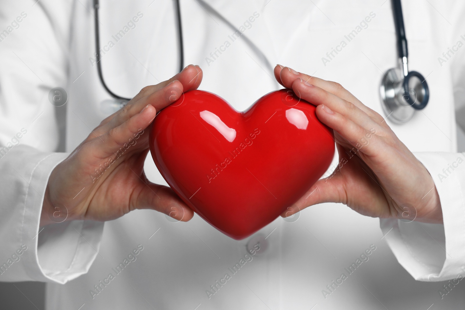 Photo of Doctor with stethoscope and red heart, closeup