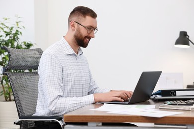 Man with good posture working in office