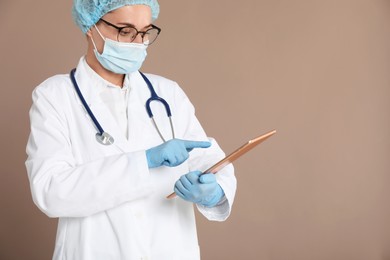 Photo of Doctor with tablet on beige background. Space for text