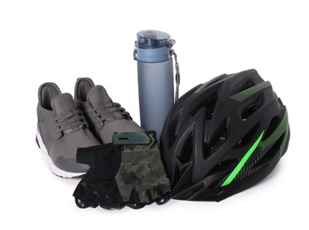 Bicycle helmet, sneakers, thermo bottle and fingerless gloves isolated on white