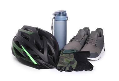 Photo of Bicycle helmet, sneakers, thermo bottle and fingerless gloves isolated on white