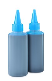 Bottles of light blue printer ink isolated on white