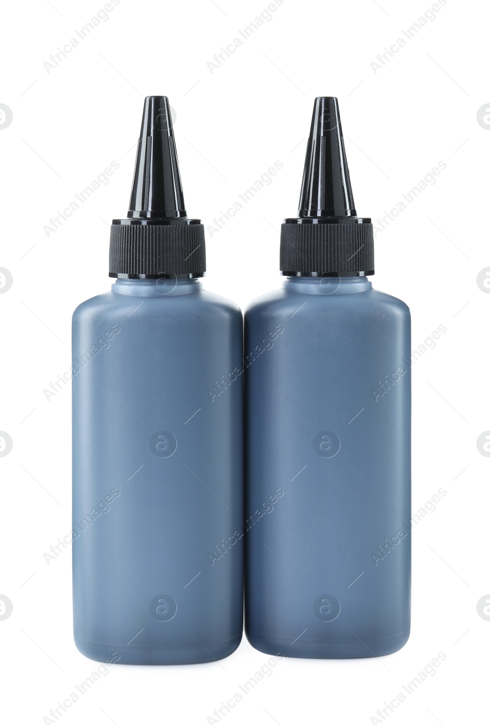 Photo of Bottles of black printer ink isolated on white